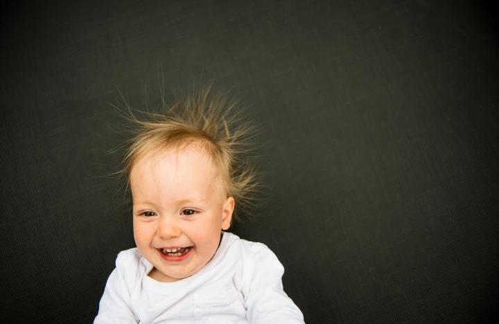 Baby with frizzy hair. Photo by Martin Novak/Shutterstock