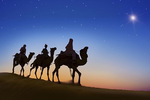 three wise men on camels using the star of bethlehem to navigate