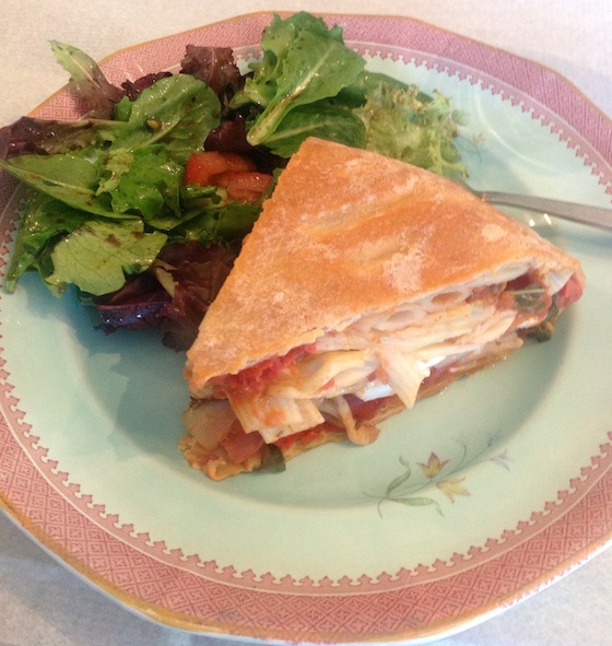 finished timpano with a side salad