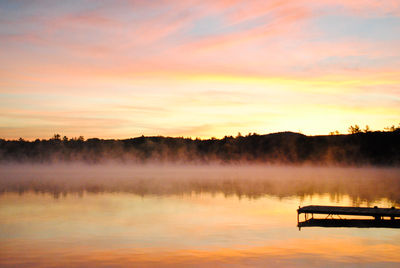 Sunrise on lake with fog