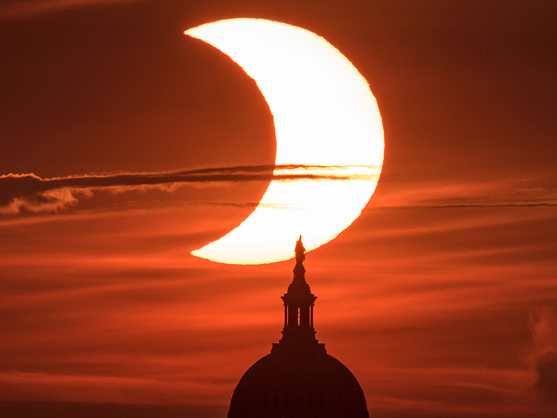 A partial solar eclipse with the United States Capitol Building on June 10, 2021. Credit: NASA