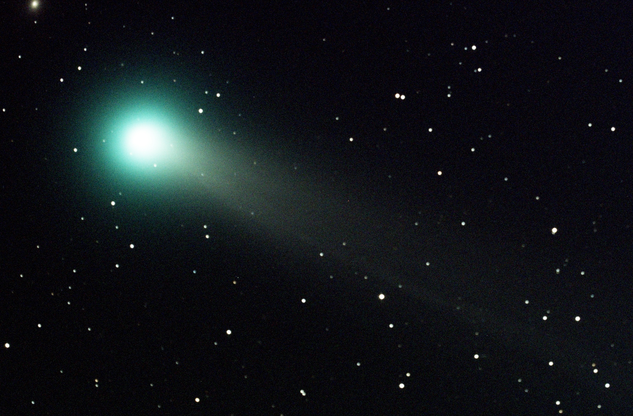 Comet Lovejoy in Ursa Major in the night sky with stars