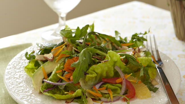 greens and Calendula salad on a plate