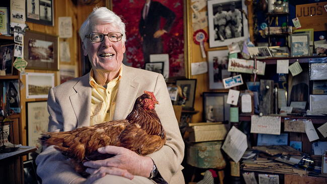 Jud Hale in his office holding a stuffed chicken