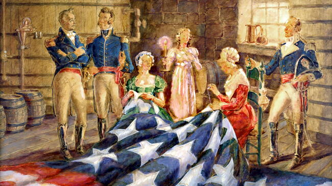 Historical painting of Mary Pickersgill and her assistants hand‑sewing the Star‑Spangled Banner flag in her Baltimore workshop.
