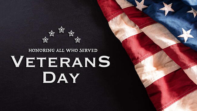 Happy Veterans Day concept. Vintage American flags against blackboard background. November 11.