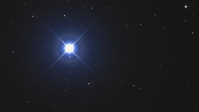 A very bright bluish star named Vega or Alpha Lyrae in the constellation Lyra taken with CCD camera through medium focal length telescope