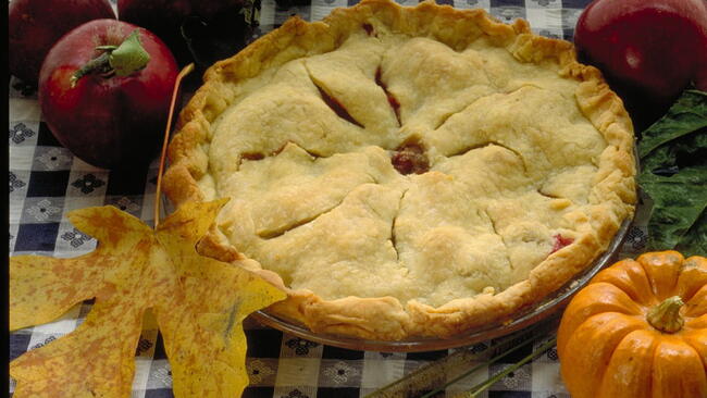 Apple Pie on a table with a plaid tablecloth