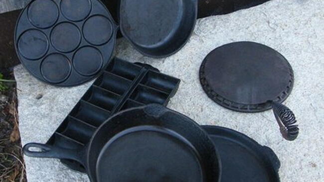 assortment of cast iron pans