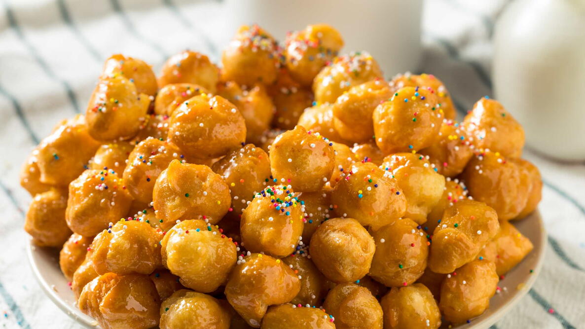 Homemade Sweet Italian Struffoli with Honey and Sprinkles