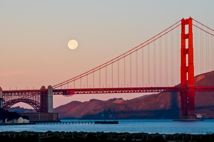 Full moon over the Golden Gate Bridge in San Francisco, CA.