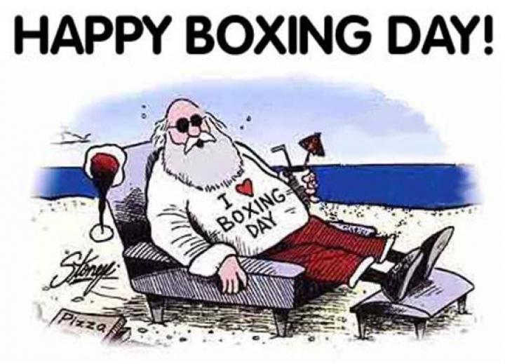 santa on a beach with an i love boxing day shirt on and a drink in his hand